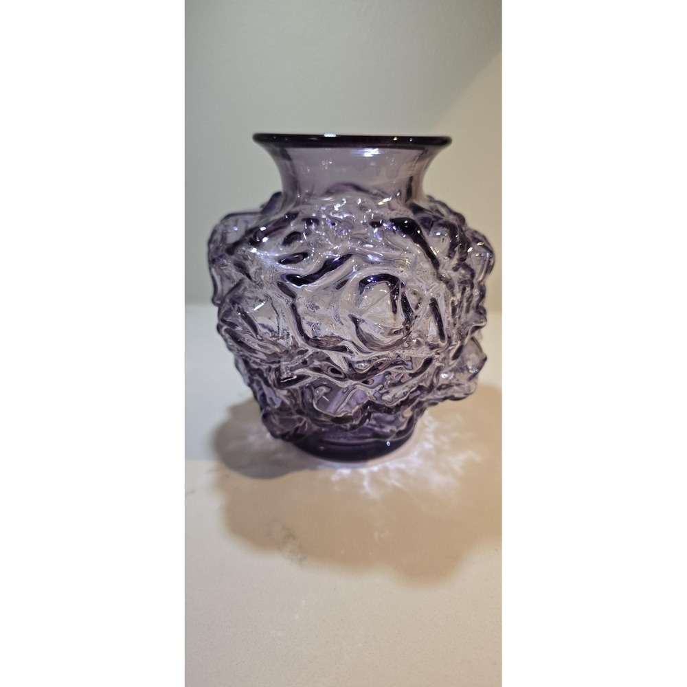 Indiana Glass manufactured these heavily textured rose-and-leaf pattern...